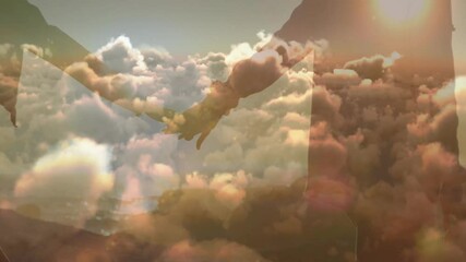 Animation of blue sky and clouds over biracial couple holding hands at beach