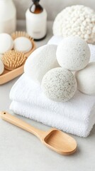 A collection of herbal bath bombs, towels, and a wooden scoop, bath bombs, towels, wooden scoop