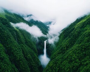 Obraz premium Waterfall cascading down a steep mountain slope, with dramatic clouds above, waterfall cascade, epic landscape aesthetic