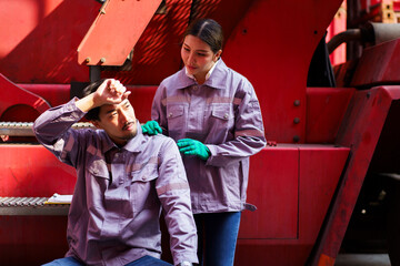 Asian workers drink water from bottle between working in outdoor in hot day.