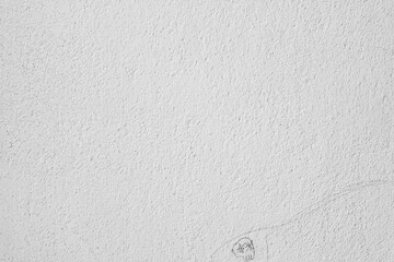 grey and white background with a grungy texture of cement covers the table top, viewed from above, while plaster walls add a dark contrast in the room, creating a calm, bright design overall.