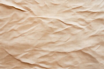 Close-up of crumpled beige fabric, showcasing textures and patterns for artistic or design purposes.