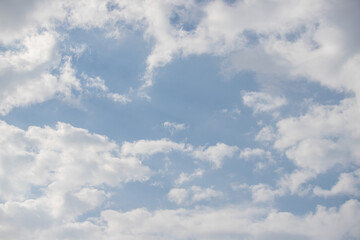 Sky background with clouds. White clouds against a blue sky.