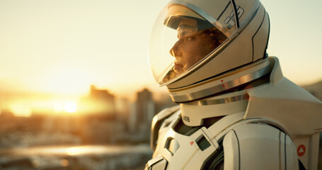 Astronaut, woman and thinking in city for future, planet dystopia and spacesuit of aerospace mission. Earth, person and view for emergency safety, sci fi journey and adventure of urban survival © HockleyM3/peopleimages.com