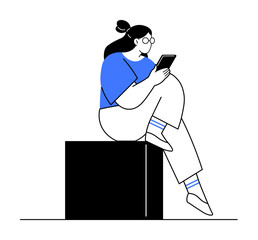 A young woman with glasses, wearing a blue shirt, sits on a black cube reading a tablet. Ideal for education, technology, digital learning, reading, and relaxation themes. Clean, minimal style.