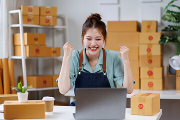 Excited happy, Attractive young asian chinese SME owners woman entrepreneurs working on receipt box and check online orders, SME home business ideas online.