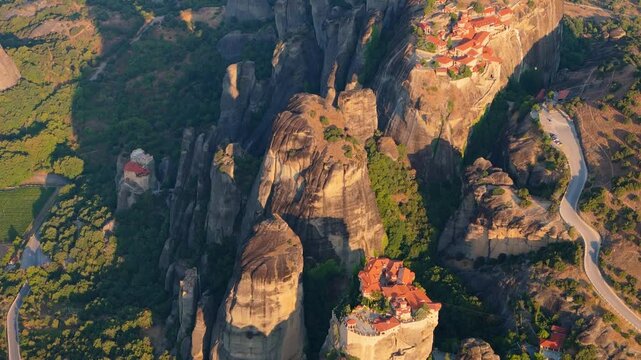 Greece Meteora region unique mountain formations and monasteries on it 4k videos taken with drone at sunrise