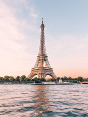 Fototapeta premium A luxurious cityscape of the Eiffel Tower at sunset, reflecting in the Seine River. A romantic and sleek destination for high-end travelers, with vibrant colors and modern elegance.