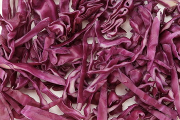 Purple Cabbage Slices or kol ungu, textured background

