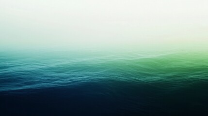 Obraz premium A smooth gradient background transitioning from deep sea blue to lush green, evoking the essence of nature.