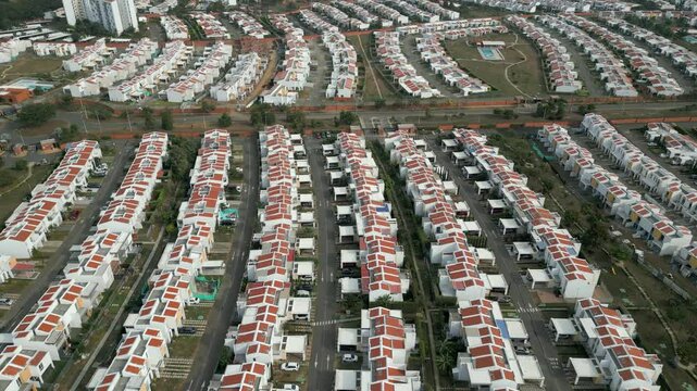 Aerial Landscape of Suburban Neighborhood El Castillo Jamundi Valle del Cauca Colombia. Descending Tilt Up Shot