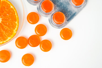 Medical lozenges for relief cough, sore throat and throat irritation isolated on white background