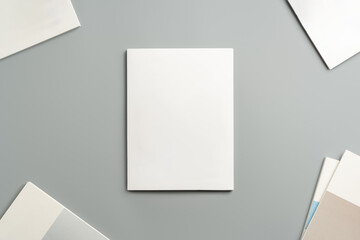 Empty White Sheet of Paper Positioned at an Angle on Light Gray Surface