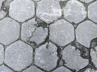 A mesmerizing arrangement of hexagonal blocks, some whole and others fragmented, forming a visually dynamic abstract composition.