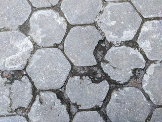 A mesmerizing arrangement of hexagonal blocks, some whole and others fragmented, forming a visually dynamic abstract composition.