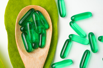 Softgels green, supplements, fish oil, omega 3, vitamin D3, vitamin E oil filled capsules