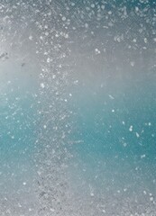 Fototapeta premium a close-up view of a textured surface with a gradient of blue and gray tones, resembling a frozen lake or a snow-covered landscape.