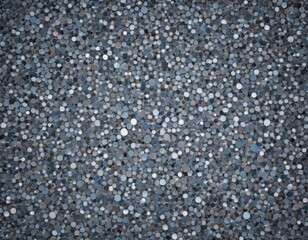 Obraz premium a close-up view of a textured surface composed of numerous small, circular dots in various shades of gray, white, and black.