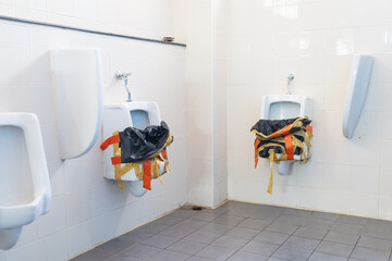 The urinal in the men's toilet was closed.Ceramic urinal in public toilet for men that was blocked due to blockage.