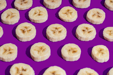 Banana slices on a purple surface