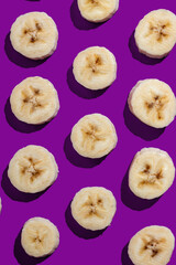 Banana slices on a purple surface