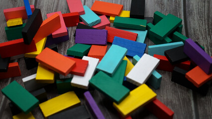 colorful bricks on white backgrounds in different positions and shapes making buildings