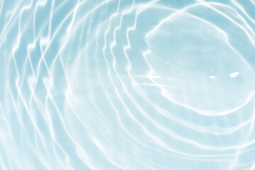 Blue water with ripples on the surface. Defocus blurred transparent blue colored clear calm water...