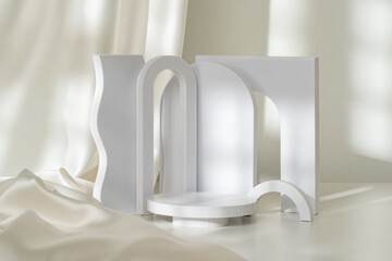 Modern Minimalist White Sculpture Displayed on Soft Draped Fabric in Natural Light