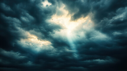 Obraz premium Dark clouds with sun breaking through create dramatic and moody atmosphere, evoking sense of awe and wonder in sky