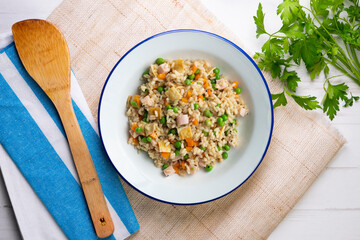 Brown rice with vegetables and turkey cubes. Top view.