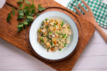 Brown rice with vegetables and turkey cubes. Top view.