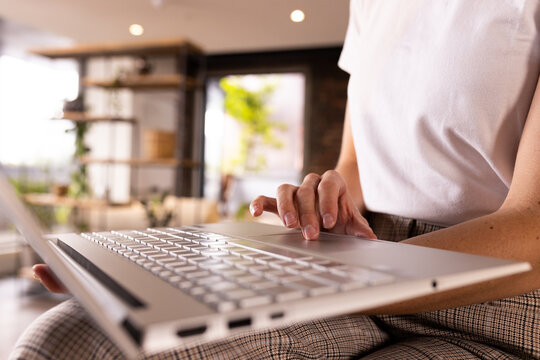 At office, Typing on laptop, woman working on creative writing business project indoors