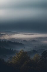 Fototapeta premium A dark blue sky with clouds and a foggy mist.