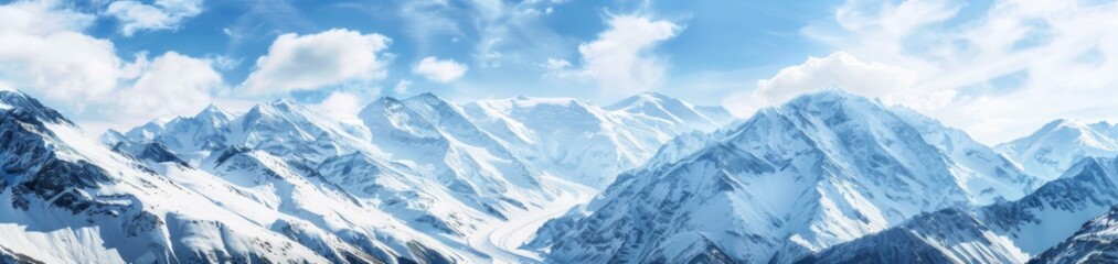 Obraz premium A large group of snow covered mountains with clouds in the sky. AI.