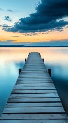 Obraz premium Wooden pier over calm water at sunset