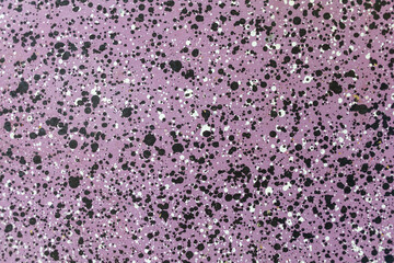 Fototapeta premium Popular polka dot dropped on purple background. circles of black, white, in different sizes. random small and large.