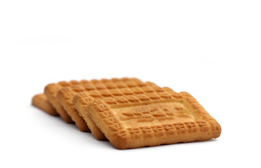 Indian biscuits stacked over white background