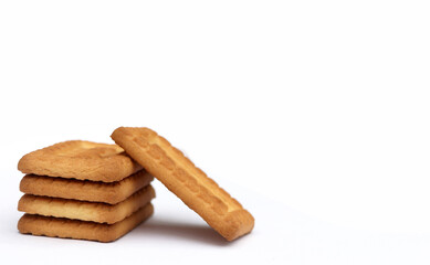 Indian biscuits stacked over white background