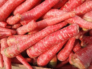 A pile of fresh red carrots