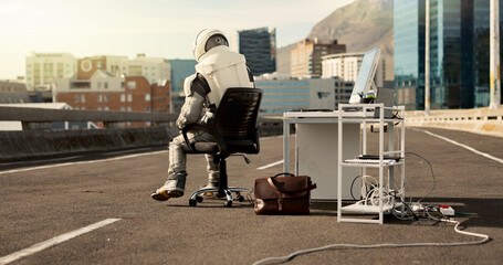 Back, city and astronaut working in road for business project with interstellar report for mission. Technology, person and bored space pilot at desk with discovery of civilization on bridge in town. © HockleyM3/peopleimages.com