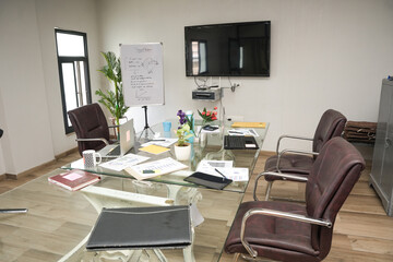Interior of a modern office meeting room. spacious hall for holding conference with wall tv for presentation.