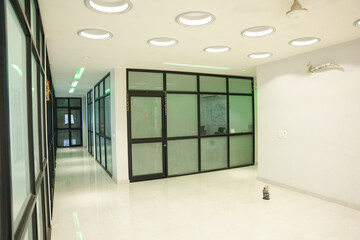 Empty corridor area in the modern office building. glass wall, concept of hallway, lobby.