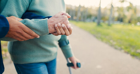 Park, walking stick and caregiver with senior woman for assisted living, support and care in...