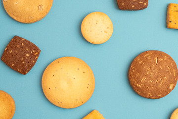 cookies on the light blue background. 水色背景の上に置かれたクッキー	
