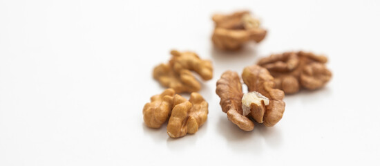 Half a walnut isolate. Peeled walnut on white. Walnut top view. Set with clipping path. Full depth of field