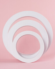 white circle props on pink background