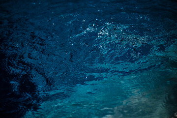 Beautiful turquoise blue water bubbling in a small whirlpool