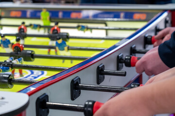 Closeup shot of a man playing table football