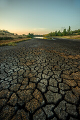 Half-dried lake b legacy of global warming summer b hot days in the summer dried up the lake. Cracked earth around the lake. The water level in the lake dropped to impressive proportions