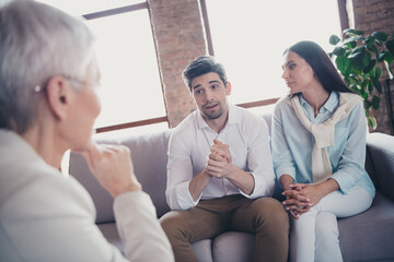 Fototapeta premium Photo of young couple communicate appointment psychotherapist loft interior office indoors